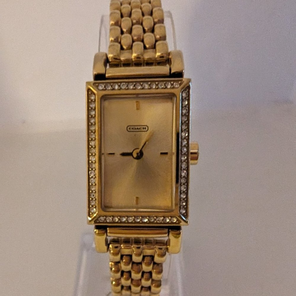 Coach square face goldtone watch with crystals. Stainless Steel, water resistent